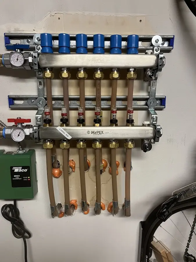 Plumber performing Water Heater Repair at a residential property in Muttontown